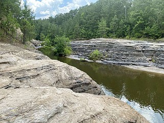 The scene along the creek just below the White Oak Lake spillway is far different from what one would expect to see in southern Arkansas. (The Sentinel-Record/Corbet Deary)